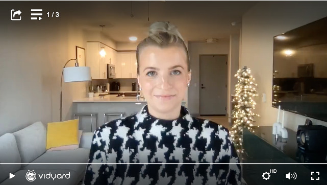 A screenshot of a Vidyard video featuring Katherine Caldwell in a professional setting facing the camera in a selfie-style video.