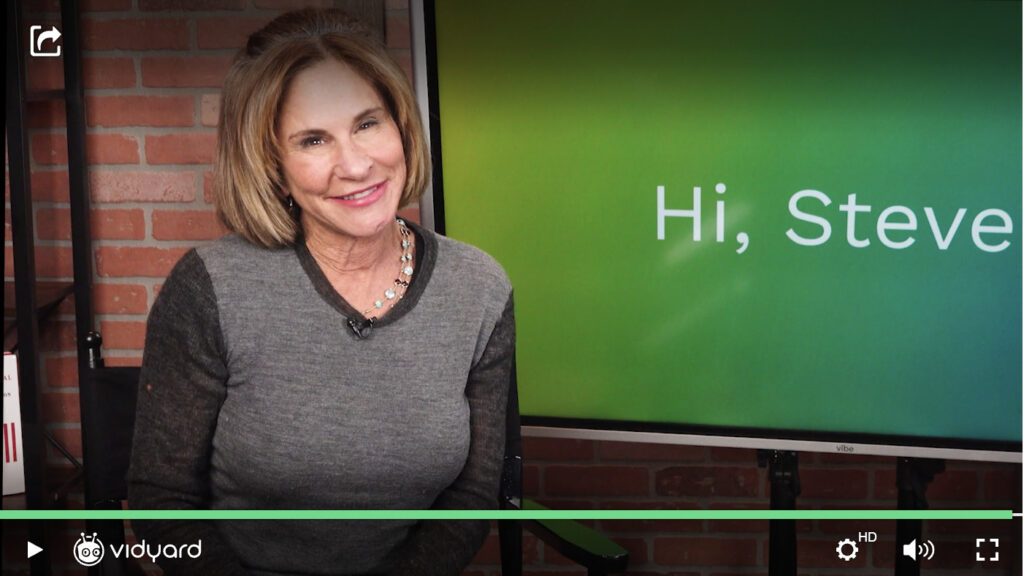 A screenshot of a Vidyard video featuring salesperson Shari Levitin in front of a green background.