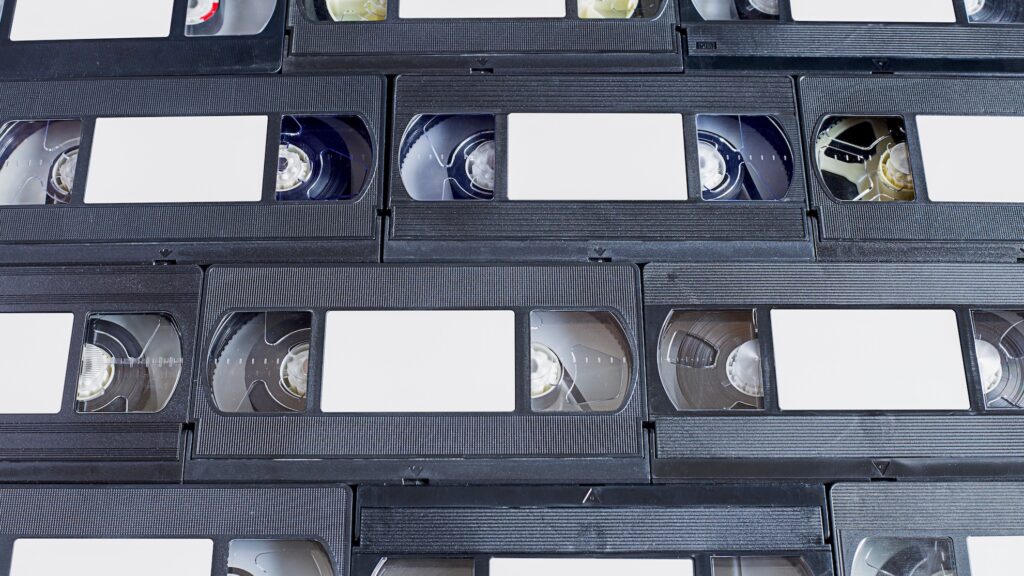 A library of video tapes representing the best video hosting sites