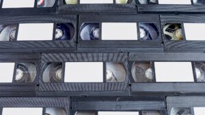 A library of video tapes representing the best video hosting sites