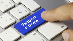 A person pushing a button to request demo videos.