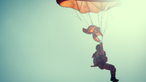 Person parachuting representing how to get into tech sales to land the right job