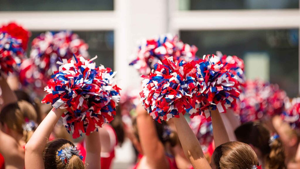 Hands cheering with pom poms