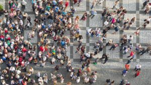 Group of people walking across the street