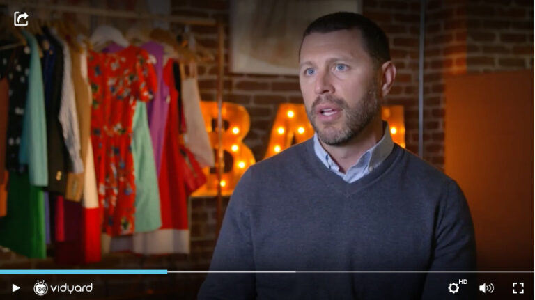 A screenshot of a Vidyard video featuring a male business person