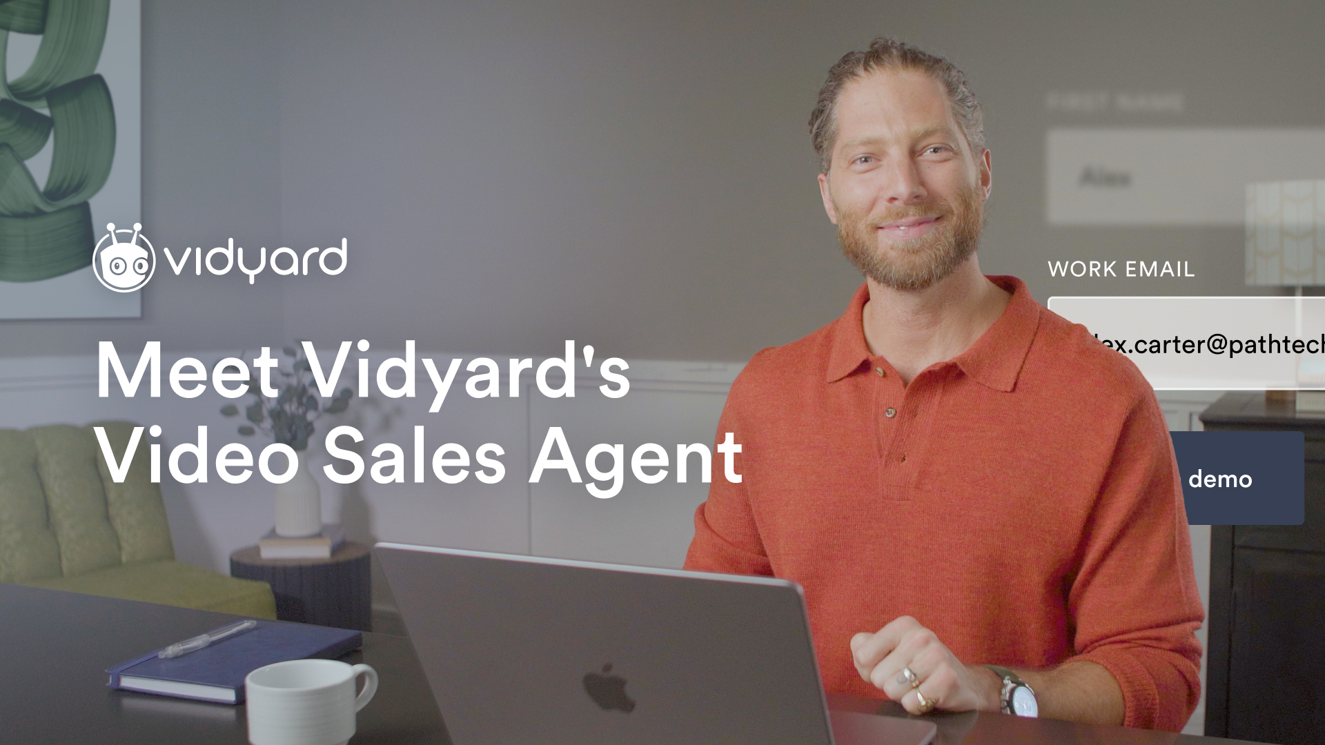 A smiling man sitting in front of a laptop, with the title 